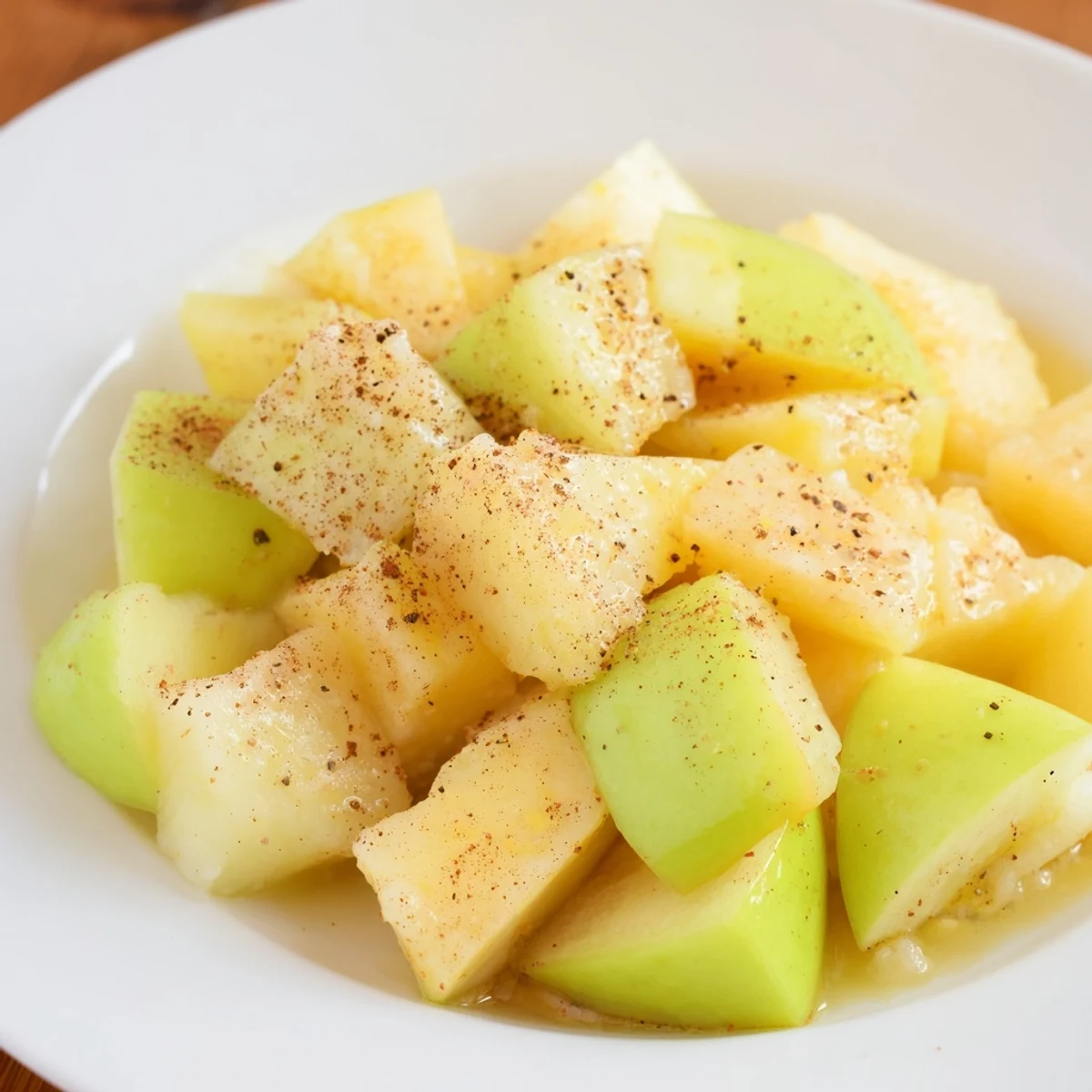 Slow Cooker Stewed Apples, simmered until tender, offer a sweet, cinnamon-infused breakfast topping.